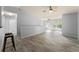Spacious living area with wood-look tile floors and a neutral color scheme at 4368 S Kirkman Rd # 212, Orlando, FL 32811