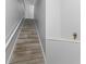 Indoor staircase with wood-look tile and neutral wall colors at 4368 S Kirkman Rd # 212, Orlando, FL 32811