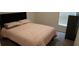 Cozy bedroom with a full-size bed at 462 Hamlet Loop, Davenport, FL 33837