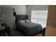 Small bedroom with a full-size bed at 462 Hamlet Loop, Davenport, FL 33837