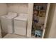 Laundry room with washer, dryer and storage shelves at 462 Hamlet Loop, Davenport, FL 33837