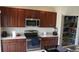 Modern kitchen with stainless steel appliances and walk-in pantry at 462 Hamlet Loop, Davenport, FL 33837