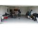 Garage with extra space and a grill at 462 Hamlet Loop, Davenport, FL 33837