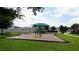 Community playground with shaded play area at 462 Hamlet Loop, Davenport, FL 33837