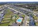Aerial view showing community layout with pool and houses at 462 Hamlet Loop, Davenport, FL 33837