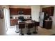 Modern kitchen with stainless steel appliances and an island at 462 Hamlet Loop, Davenport, FL 33837
