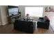 Spacious living room with two sofas and a large flat-screen TV at 462 Hamlet Loop, Davenport, FL 33837
