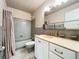 Clean bathroom with a tub/shower combo, vanity with sink, and tiled floors at 700 Melrose Ave # E-6, Winter Park, FL 32789