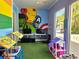 Fun ' playroom with toys and superhero mural at 5354 Diplomat Ct # 105, Kissimmee, FL 34746