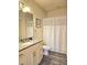 Bathroom with granite countertop, toilet, and shower/tub at 5354 Diplomat Ct # 105, Kissimmee, FL 34746