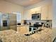 Modern kitchen with stainless steel appliances and granite countertops at 5354 Diplomat Ct # 105, Kissimmee, FL 34746