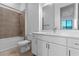 Bathroom with tub, toilet and white vanity at 38 W Harding St # B, Orlando, FL 32806