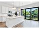 Modern kitchen with white cabinets, island, and stainless steel appliances at 38 W Harding St # B, Orlando, FL 32806