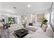 Bright and airy living room with sectional sofa and dining area at 38 W Harding St # B, Orlando, FL 32806
