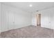 Simple bedroom with neutral walls and carpeting at 38 W Harding St # B, Orlando, FL 32806
