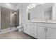 Modern bathroom with double vanity, shower, and tile flooring at 38 W Harding St # B, Orlando, FL 32806