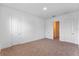 Spacious bedroom with neutral carpeting and double door entry at 42 W Harding St # B, Orlando, FL 32806