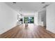 Spacious living area with hardwood floors and kitchen views at 42 W Harding St # B, Orlando, FL 32806