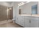 Modern bathroom with double vanity and large walk-in shower at 42 W Harding St # B, Orlando, FL 32806