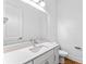 Bright bathroom features a white vanity with quartz countertop at 42 W Harding St # B, Orlando, FL 32806