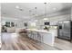 Modern kitchen with island, stainless steel appliances, and white cabinetry at 42 W Harding St # B, Orlando, FL 32806
