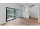 Light-filled living area with sliding glass doors and hardwood floors at 42 W Harding St # B, Orlando, FL 32806