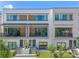 Modern townhome building with stone and wood accents at 42 W Harding St # B, Orlando, FL 32806