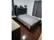 Bedroom with a queen bed and dark wood flooring at 2012 Vincent Rd, Orlando, FL 32817