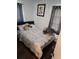 Cozy bedroom with double bed and decorative pillows at 2012 Vincent Rd, Orlando, FL 32817