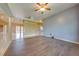 Living area with wood-look flooring and access to other rooms at 3832 Friars Cove Rd, Saint Cloud, FL 34772