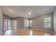 Bright bedroom with wood floors, sliding door to patio, and ceiling fan at 3832 Friars Cove Rd, Saint Cloud, FL 34772