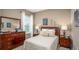 Cozy bedroom with a double bed, wood dresser, and nightstands at Unknown Arthur Ave, Edgewater, FL 32141