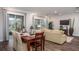 Bright dining area with a wooden table and chairs, adjacent to the living room at Unknown Arthur Ave, Edgewater, FL 32141