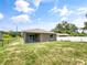 Newly constructed home with a large backyard and covered patio at 888 Old Winter Haven Rd, Auburndale, FL 33823