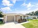 New construction home with a one-car garage and neat landscaping at 888 Old Winter Haven Rd, Auburndale, FL 33823