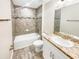 Clean bathroom, granite vanity, and tiled shower/tub at 888 Old Winter Haven Rd, Auburndale, FL 33823