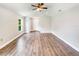 Open living room with hardwood floors and a ceiling fan at 888 Old Winter Haven Rd, Auburndale, FL 33823