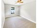 Spacious bedroom with ceiling fan and carpet at 888 Old Winter Haven Rd, Auburndale, FL 33823