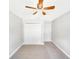Bedroom with double door closet and ceiling fan at 888 Old Winter Haven Rd, Auburndale, FL 33823