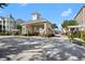 Gated entrance to community with clock tower at 3383 Westchester Square Blvd # 204, Orlando, FL 32835