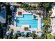 Aerial view of refreshing pool with surrounding lounge area at 3383 Westchester Square Blvd # 204, Orlando, FL 32835