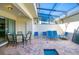 Spacious patio with seating area and adjacent pool access at 8924 Adriatico Ln, Kissimmee, FL 34747