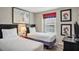Guest bedroom with two twin beds and a window at 8924 Adriatico Ln, Kissimmee, FL 34747