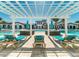 Community pool with pergola, lounge chairs, and spa at 8924 Adriatico Ln, Kissimmee, FL 34747