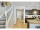 Open kitchen features granite countertops and dark cabinetry at 8924 Adriatico Ln, Kissimmee, FL 34747