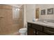 Clean bathroom with a shower and granite vanity at 8924 Adriatico Ln, Kissimmee, FL 34747