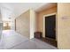 Apartment hallway with a dark door and storage container at 5530 Metrowest Blvd # 9-211, Orlando, FL 32811