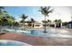 Relaxing resort-style pool with expansive deck and palm trees at 5936 High Seas Dr, Orlando, FL 32821