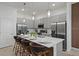 Modern kitchen with gray cabinets and a large island at 5936 High Seas Dr, Orlando, FL 32821