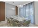 Modern dining room with a large table and seating for eight at 5936 High Seas Dr, Orlando, FL 32821